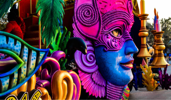 Colourful float at Goa Carnival featuring traditional masks and designs